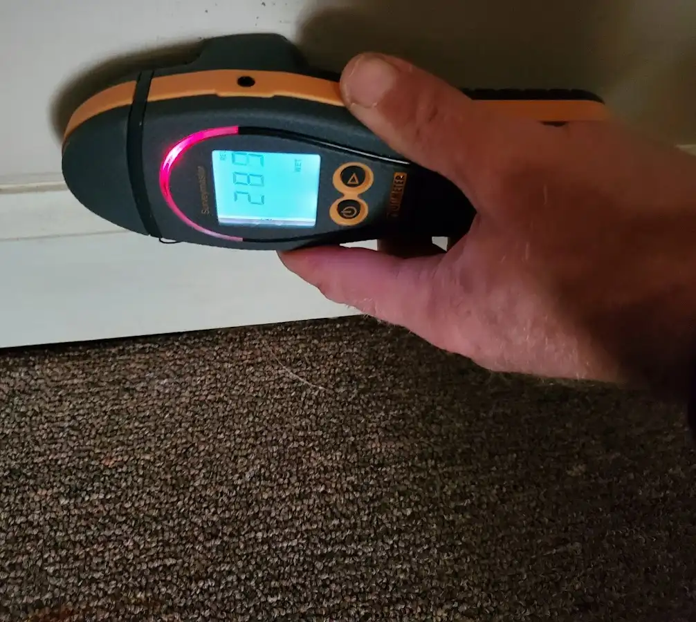 Moisture detection at baseboard during Burst Pipe Cleanup in Clinton